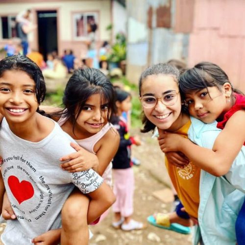 children smiling on a mission trip