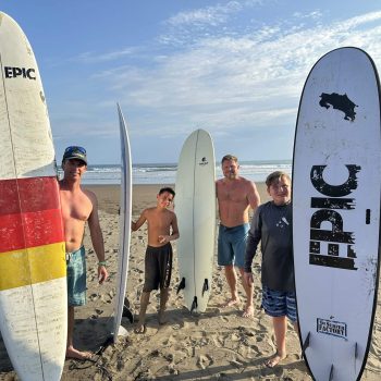 A family with surfboards